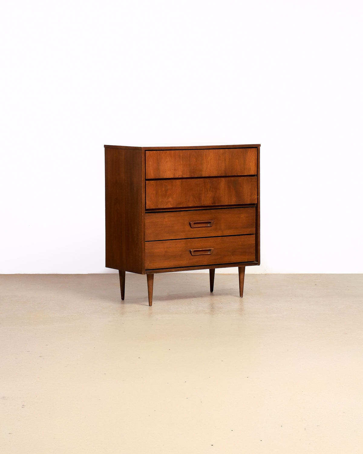 Mid-century modern dark walnut tallboy by Vic Art (1969) on a plain white background — rich walnut grain