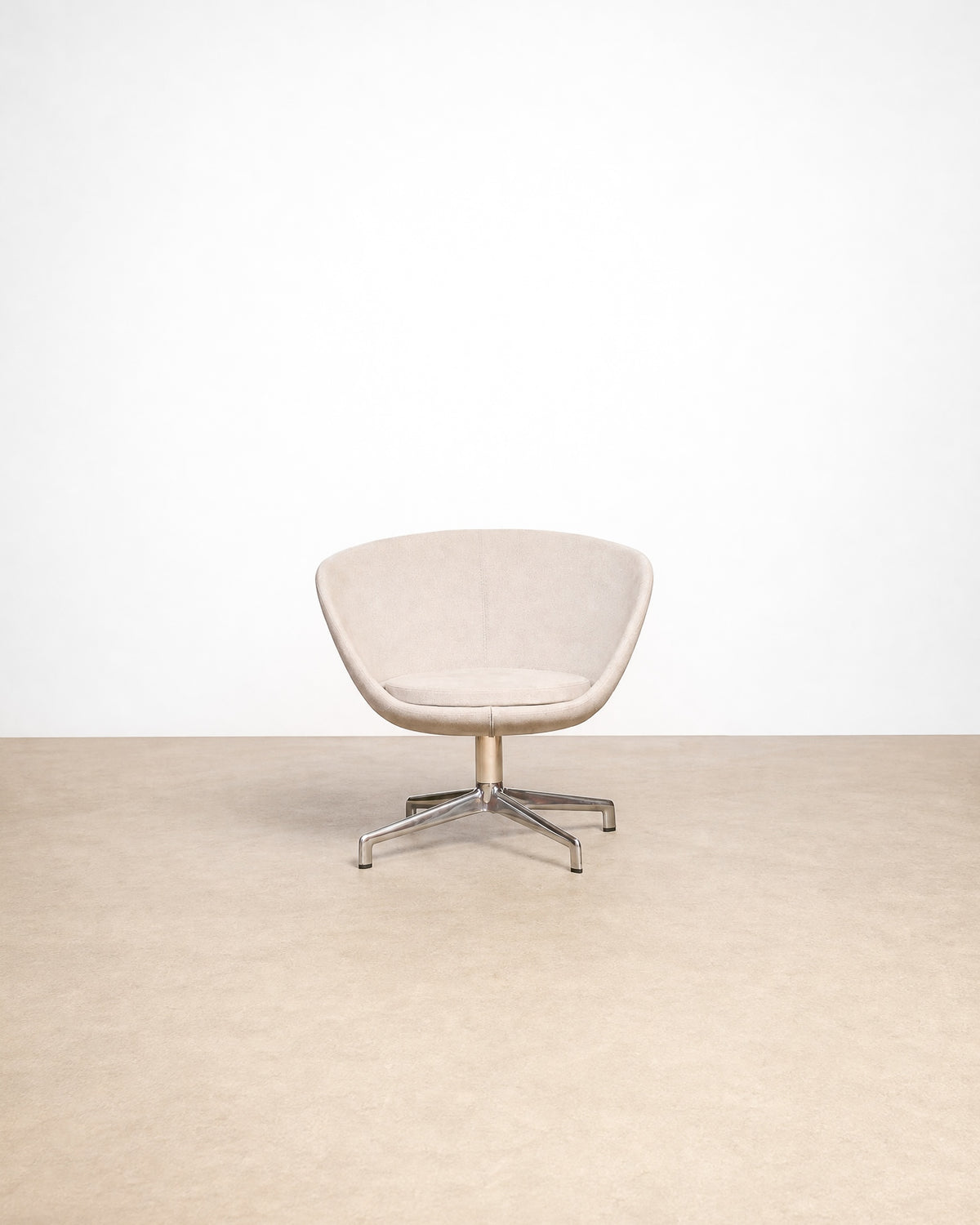 Gray lounge chair on a plain white background — sculptural mid-century-inspired frame