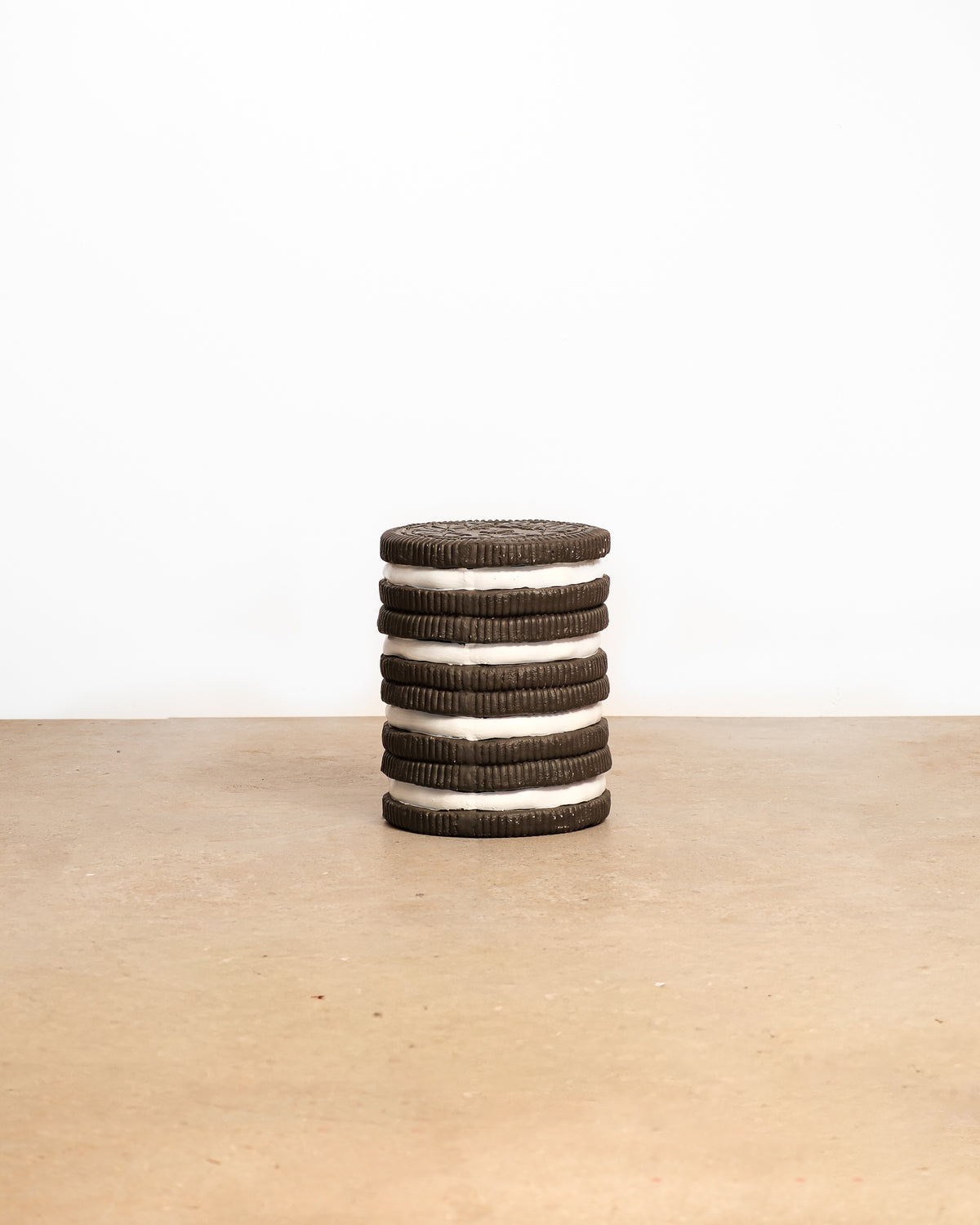 Oreo coffee table on a plain white background — round black-and-white silhouette