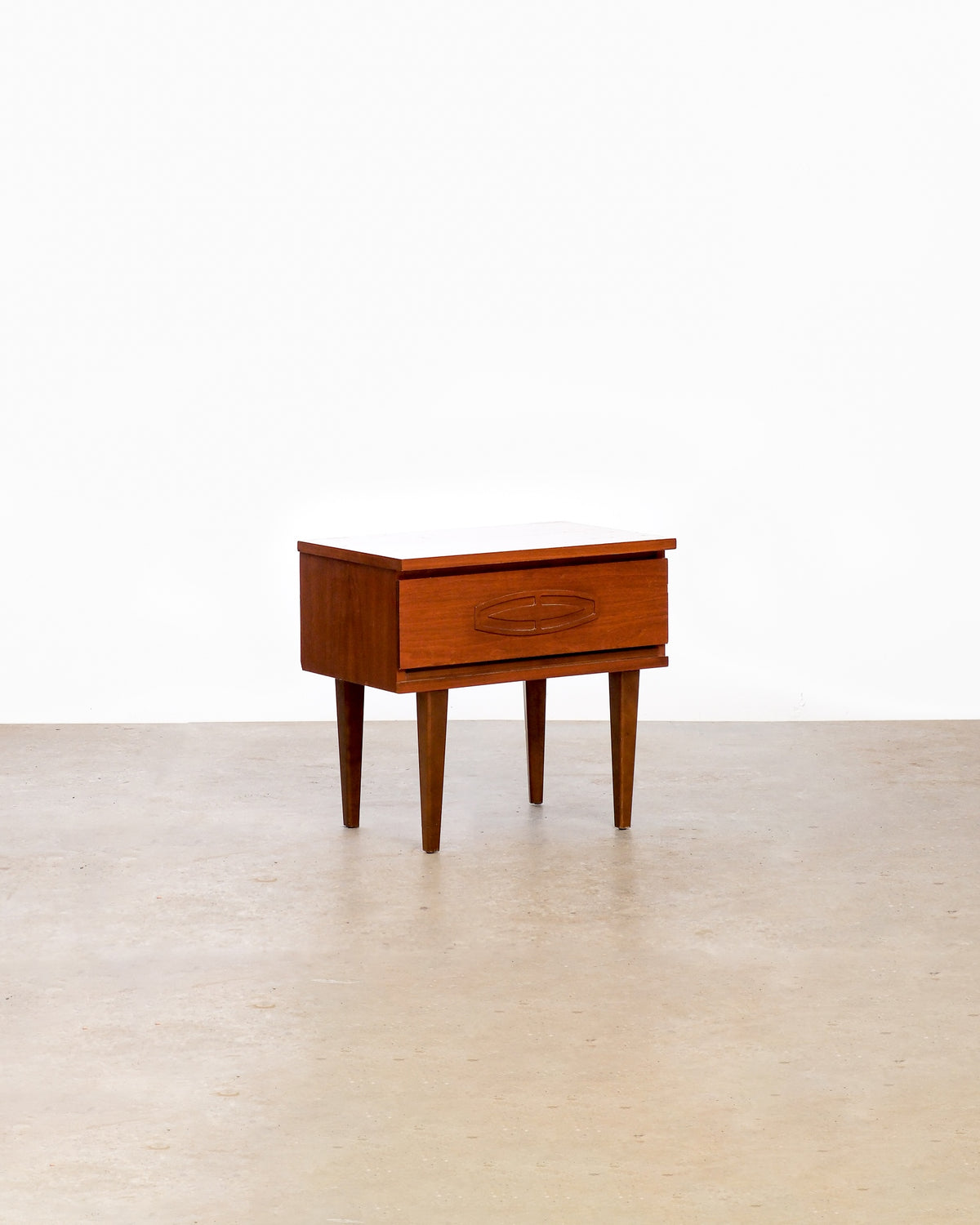 Mid-century modern walnut nightstand on a plain white background — rich walnut grain