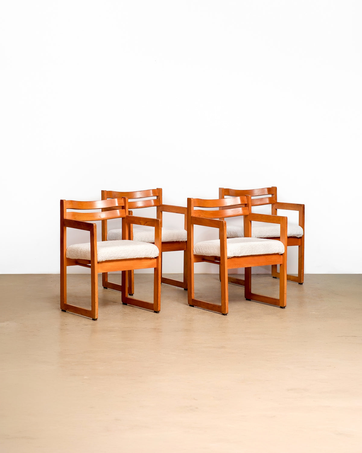 Mid-century modern oak chair set by Henderson (1962) on a plain white background — solid oak frames and new upholstery
