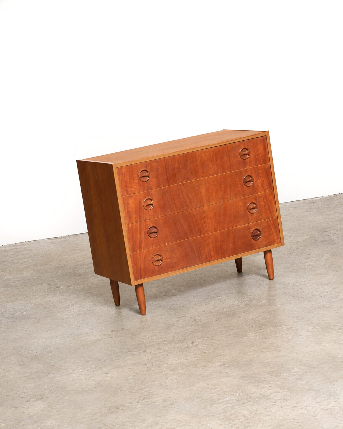 Additional detail view of the teak dresser showing case construction and finish.