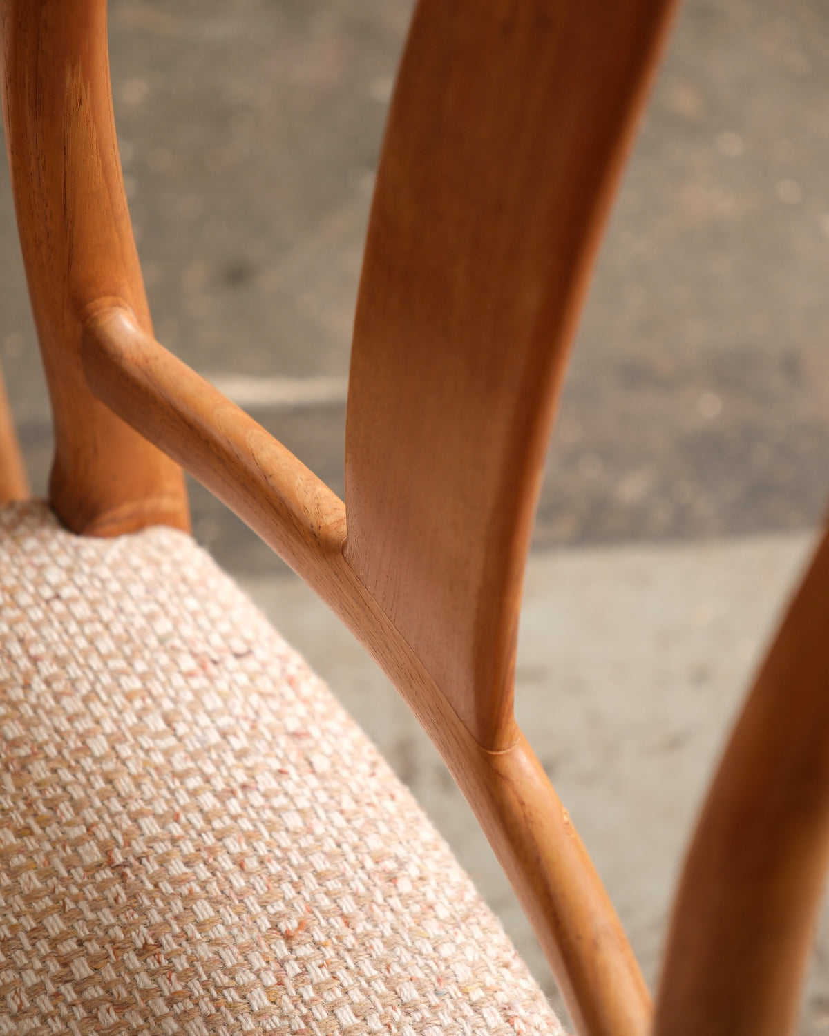 Detail of the carved joinery where the chair's backrest meets the frame