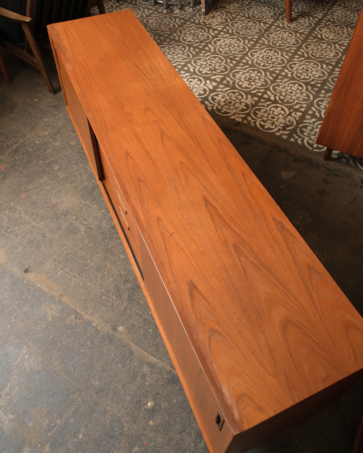 Overhead view of the sideboard highlighting the natural teak grain across the top
