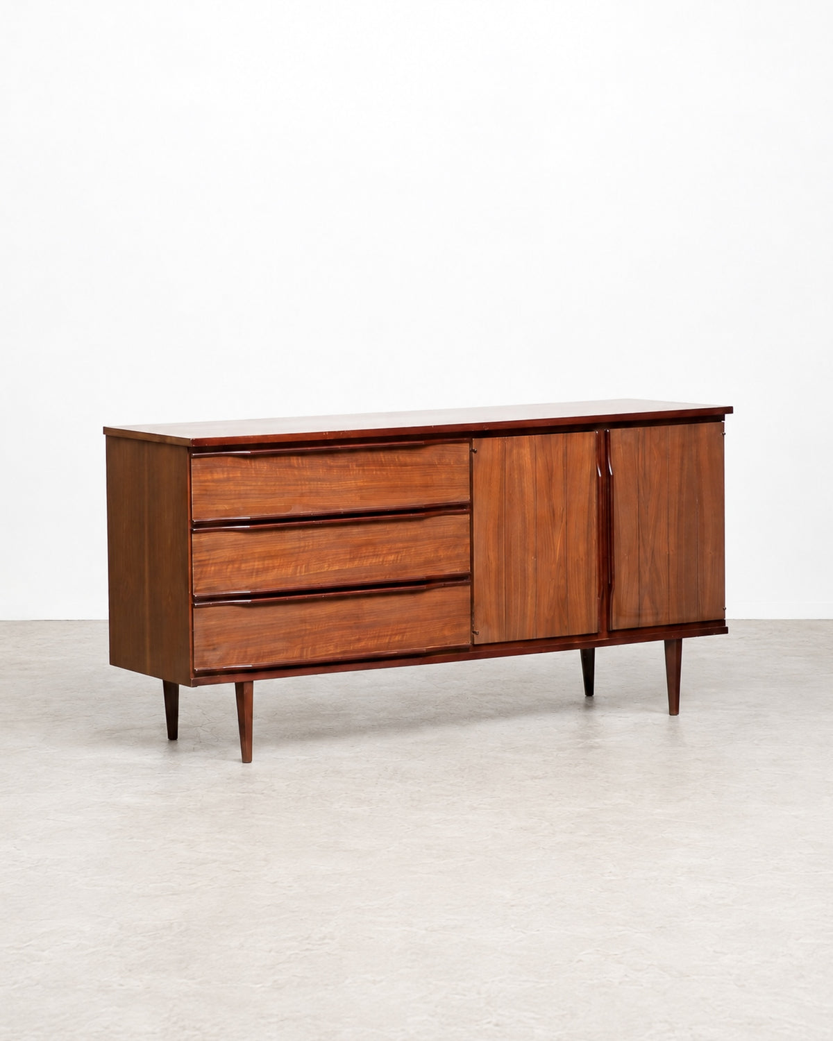 Full view of the credenza shown in the shop among other vintage furniture