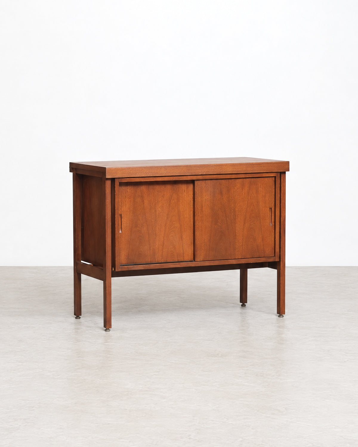 Close-up of the walnut grain and corner joinery on the top of the cabinet