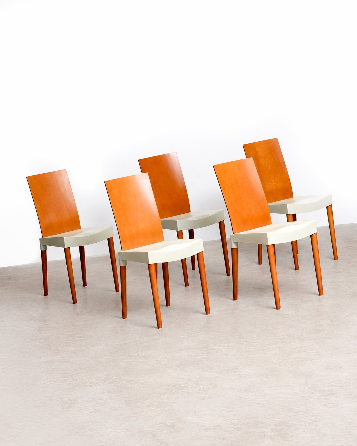 Front view of a Miss Trip chair showing the full profile and leg stance.