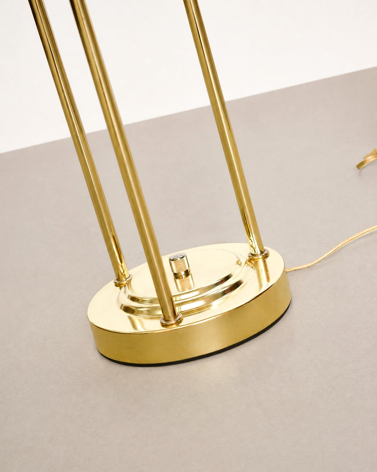Overhead angle showing the glass disc and perforated dome of the saturn lamp.