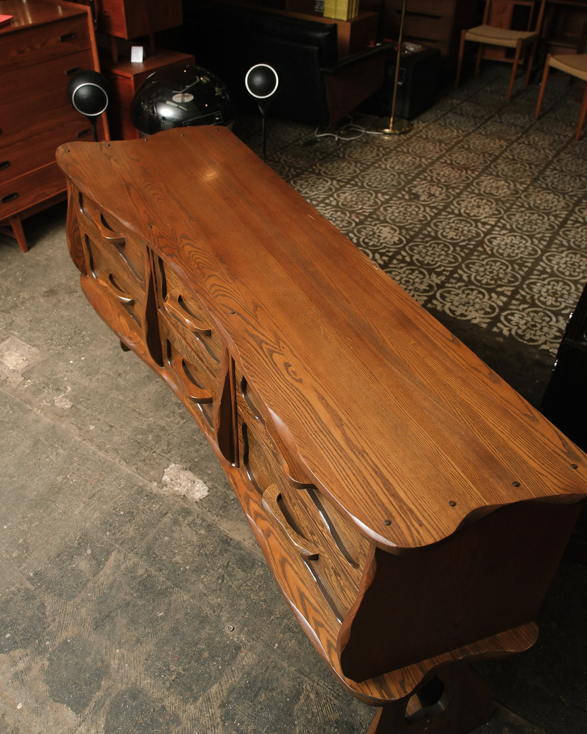 Overhead view of the dresser top showing the natural oak grain and scalloped edge detailing.