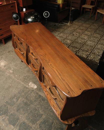 Overhead view of the dresser top showing the natural oak grain and scalloped edge detailing.