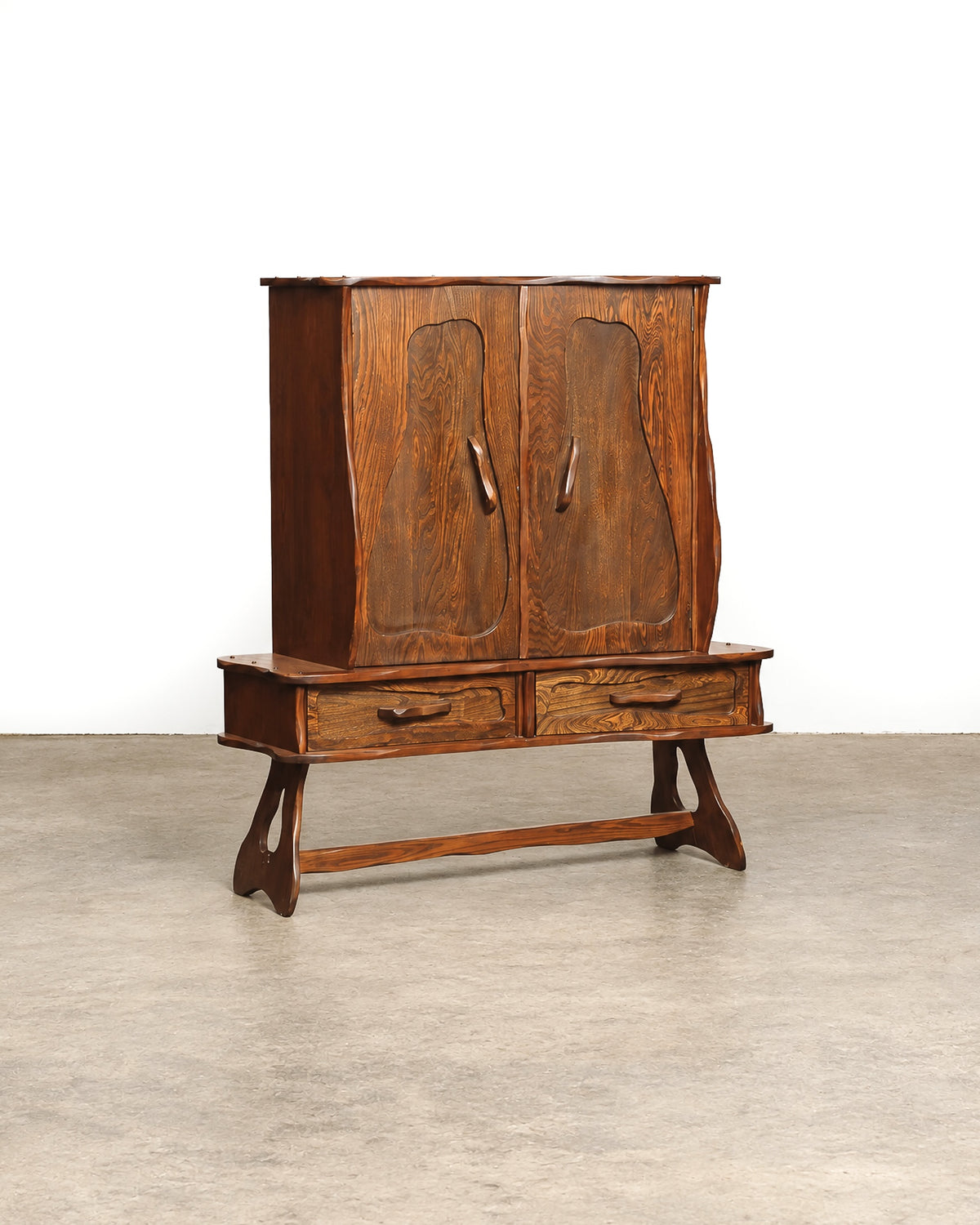 Front view of the closed cabinet on a white background, showing the full form and trestle base.