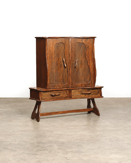 Front view of the closed cabinet on a white background, showing the full form and trestle base.