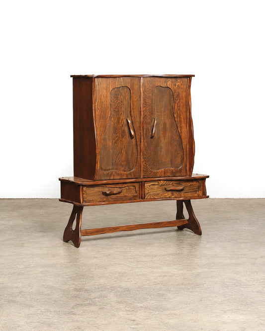 Front view of the closed cabinet on a white background, showing the full form and trestle base.