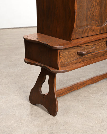 Detail of the top edge and hinge area of the cabinet.