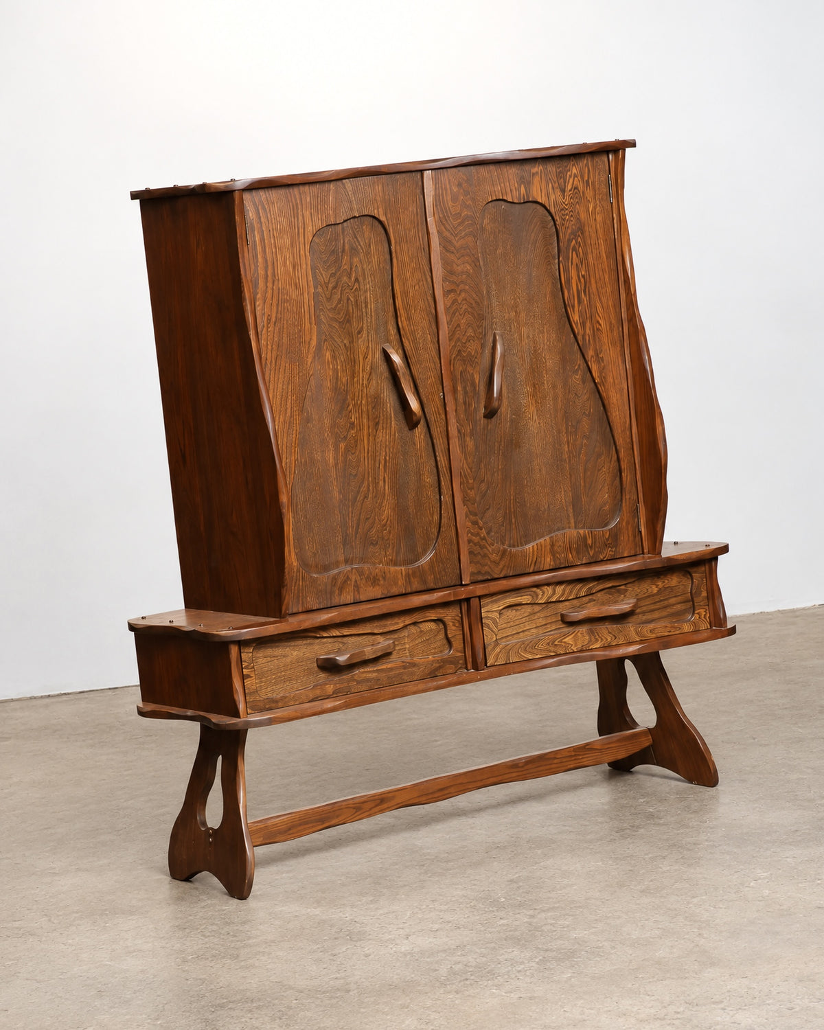 Additional angle of the cabinet showing overall proportions and carved details.