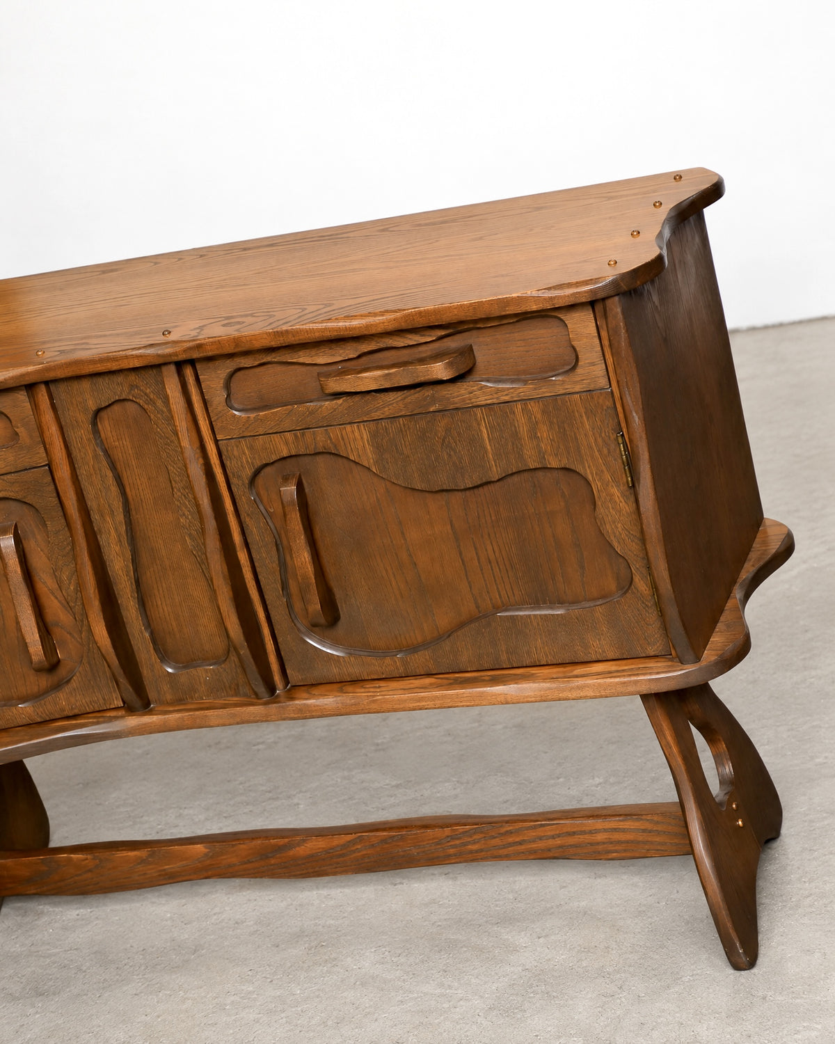 Back corner view of the sideboard showing construction and leg joinery.