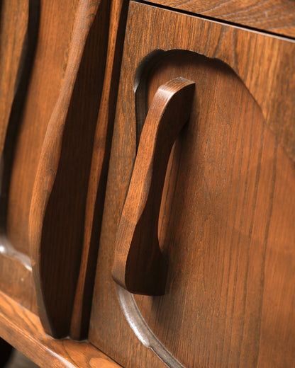 Front view of the brutalist oak sideboard showing both cabinet doors and drawers.