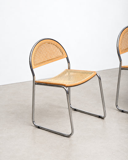 Additional angle of the cane chair highlighting the backrest curve and frame construction