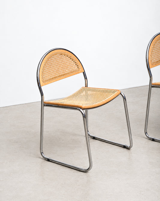 Additional angle of the cane chair highlighting the backrest curve and frame construction