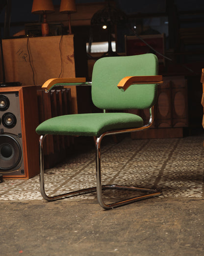 Side angle view of the Cesca-style chair highlighting the bentwood armrests and cantilevered base.