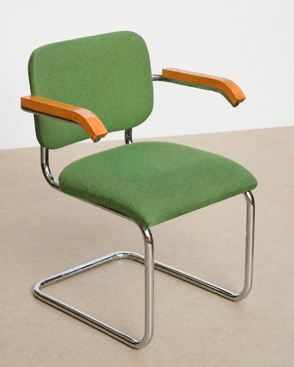 Front three-quarter studio view of the Cesca-style chair showing the full green upholstery and chrome frame.