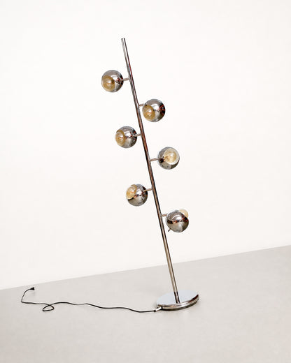 Full view of the vintage chrome floor lamp at an angle, showing all six lights and the round base with cord.