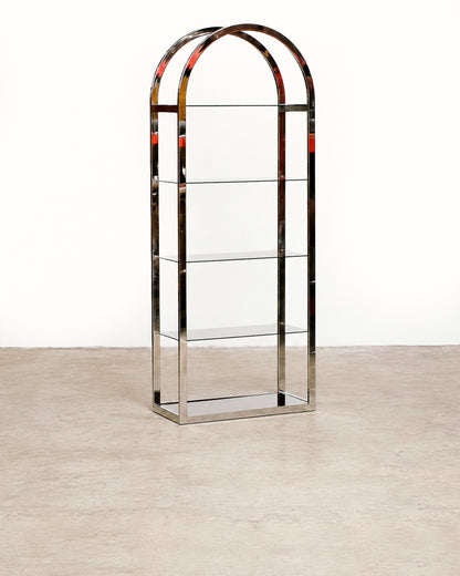 Straight-on front view of the chrome and smoked glass shelving unit showing its full arched silhouette.