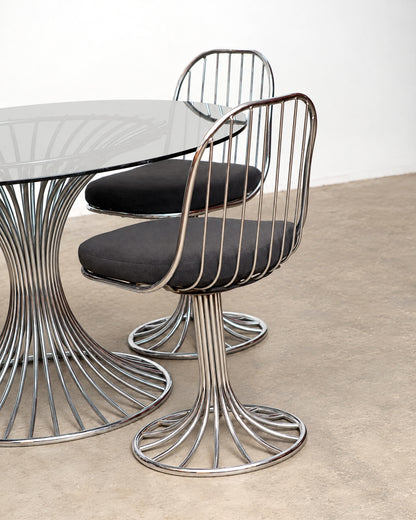 Detail of the chrome tubing where it meets the round chair base.