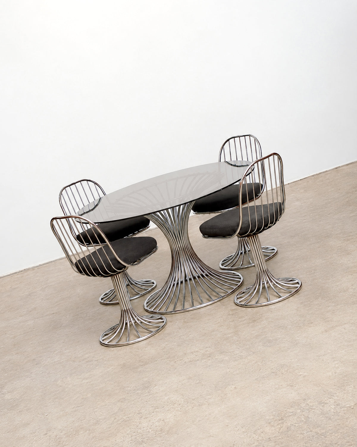 View of the chair seat cushion and surrounding wire frame.
