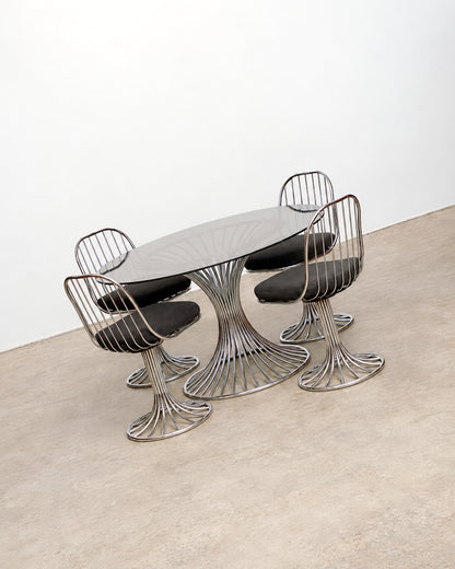 View of the chair seat cushion and surrounding wire frame.