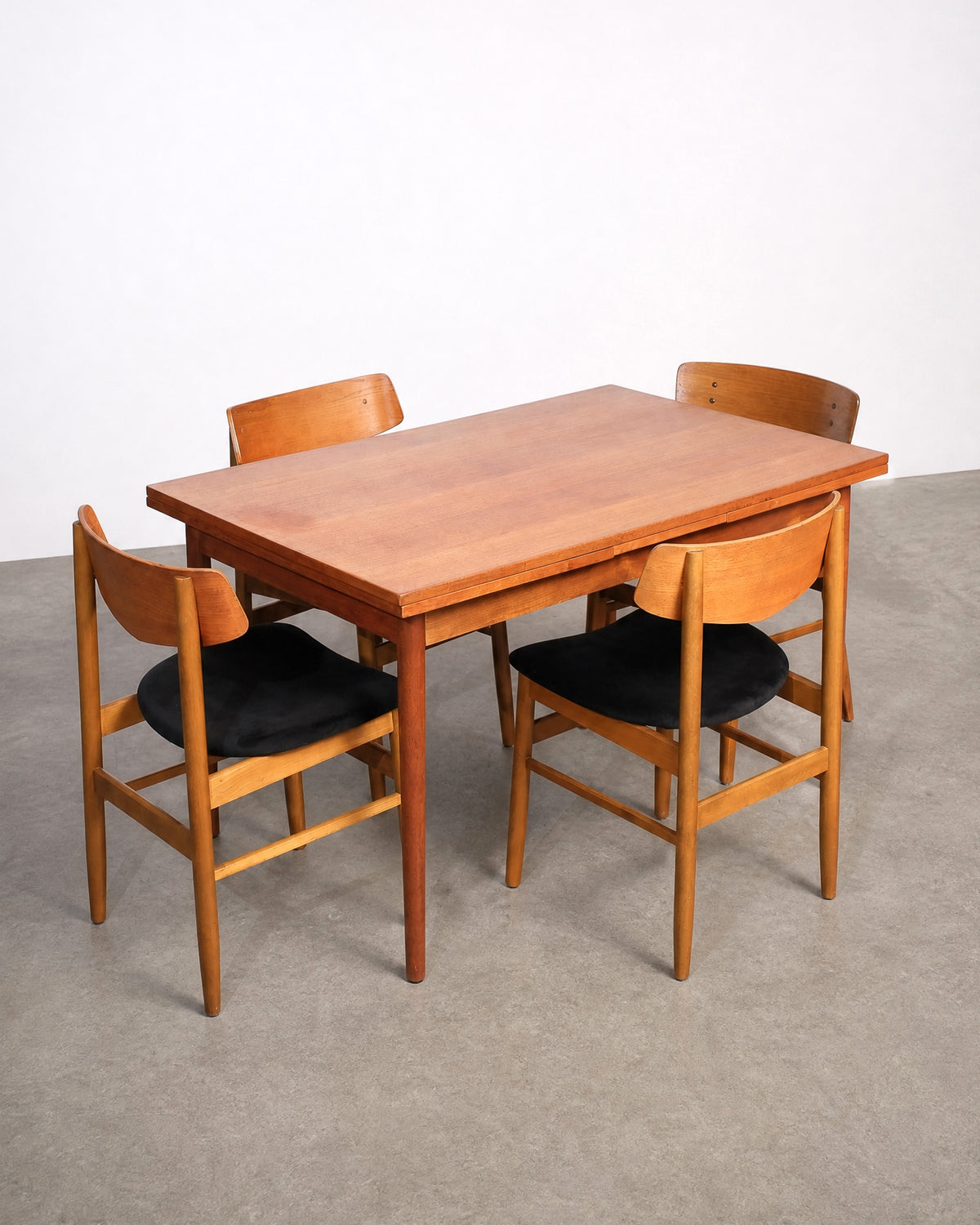 Chair shown from the side, showing the seat and leg proportions.