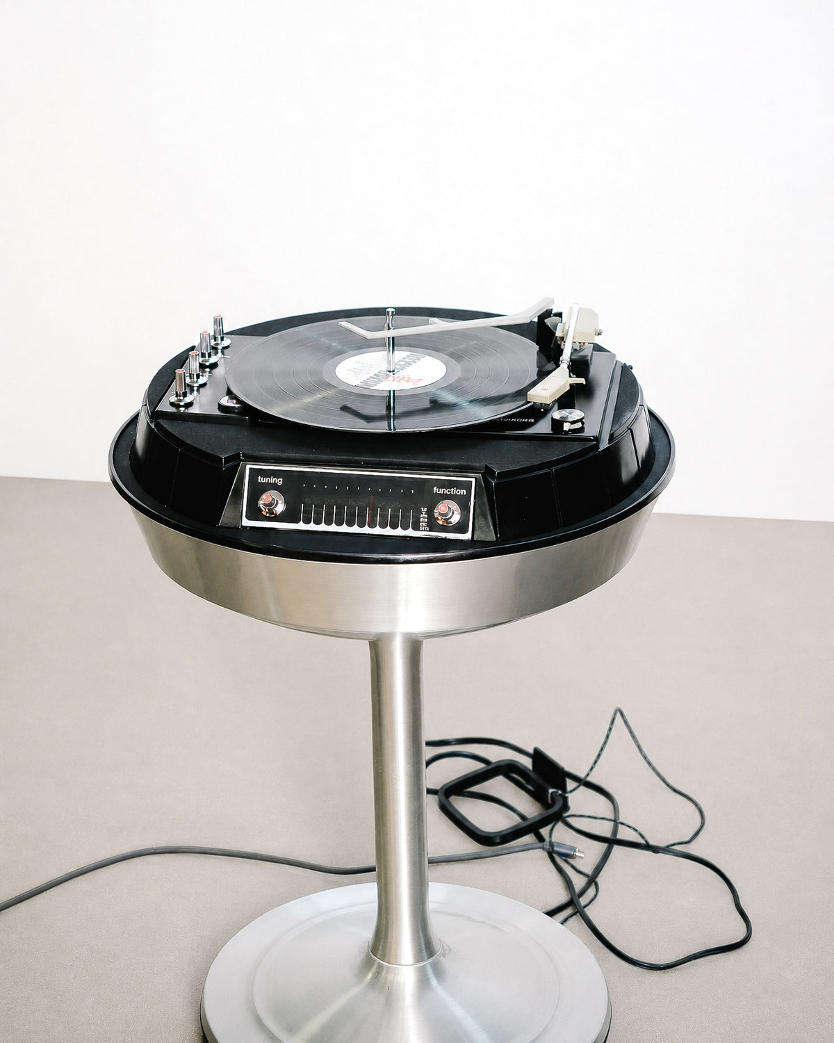 Front view of the console showing the tuning display and function selector clearly.
