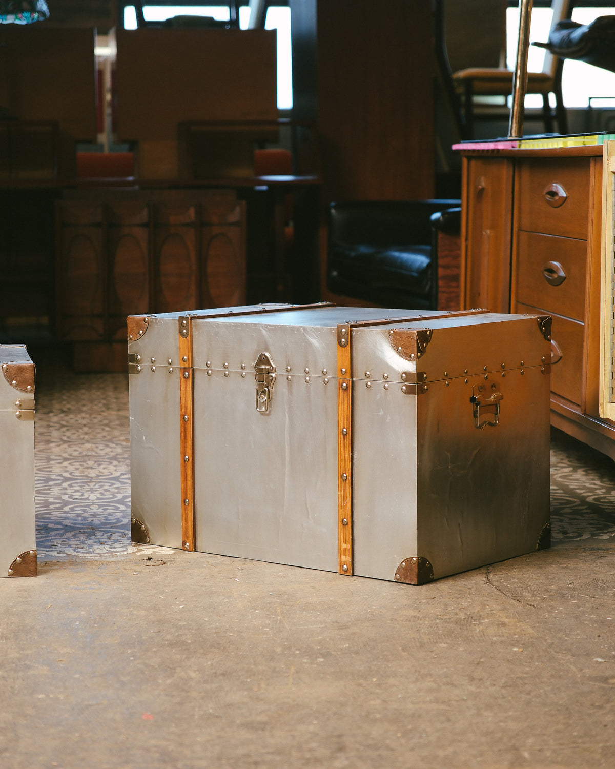 Front angle view of both trunks in the set shown together on the showroom floor.
