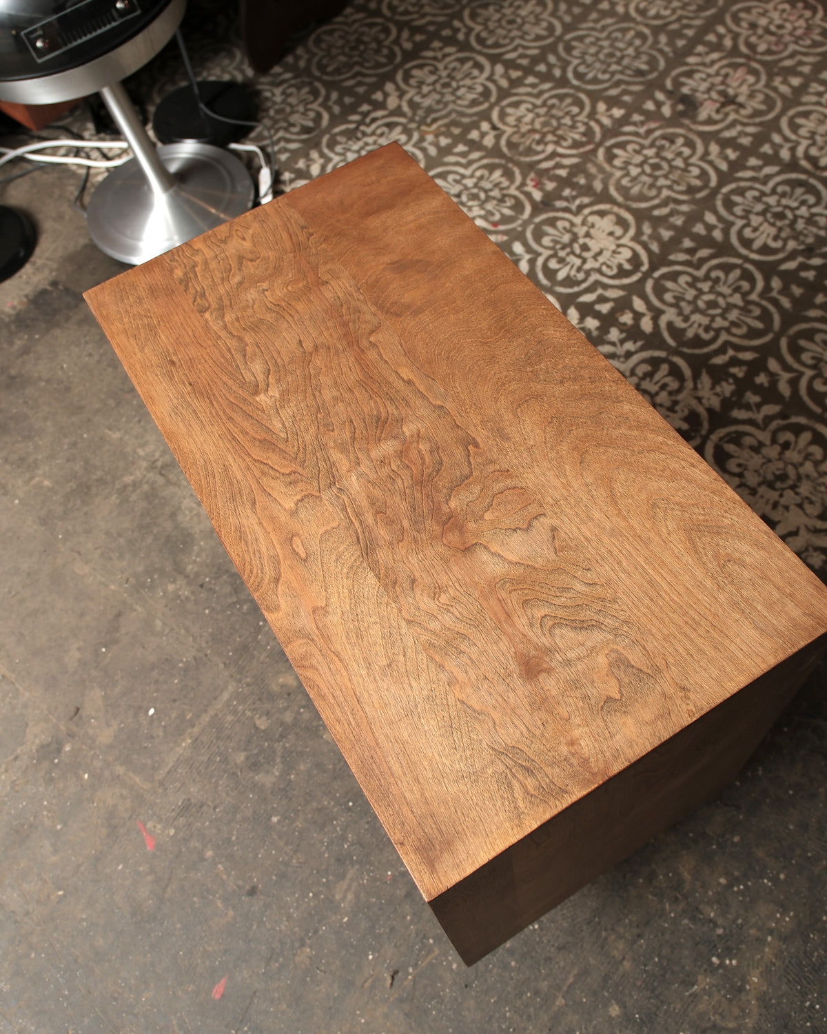 Overhead view of the dresser top showing rich birdseye wood grain detail.
