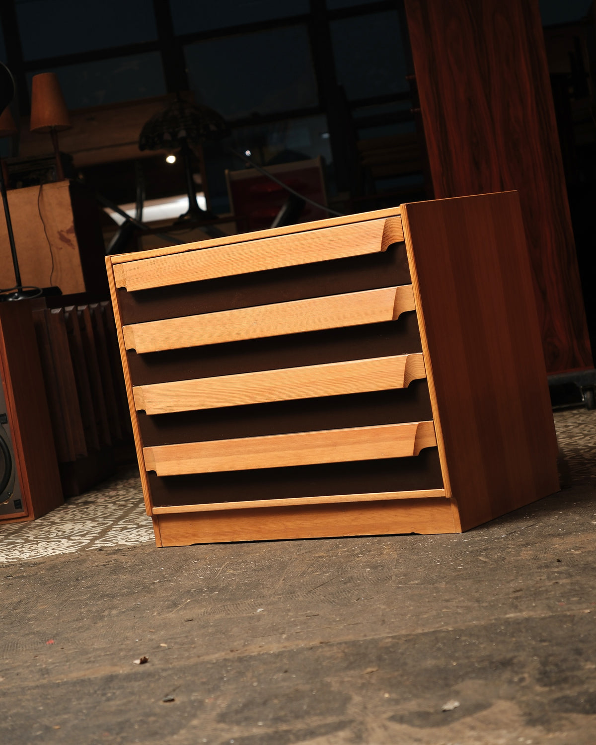 Side and front view of the dresser showing all four drawers and tapered pulls