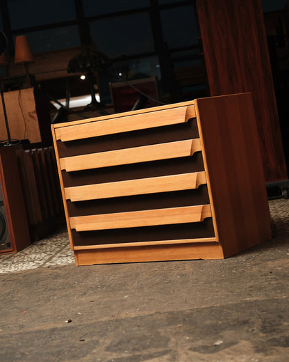 Side and front view of the dresser showing all four drawers and tapered pulls