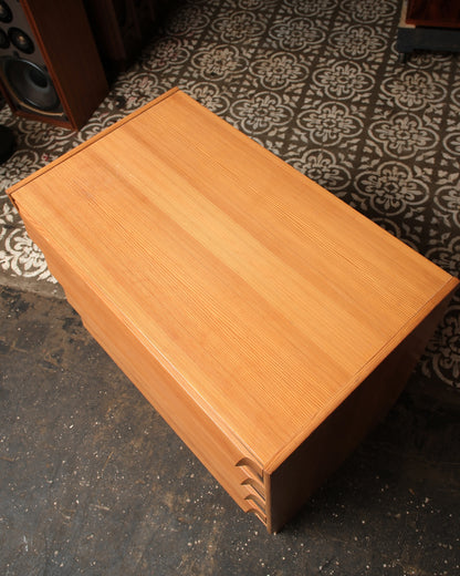 Overhead view of the dresser top showing wood grain and drawer front detail