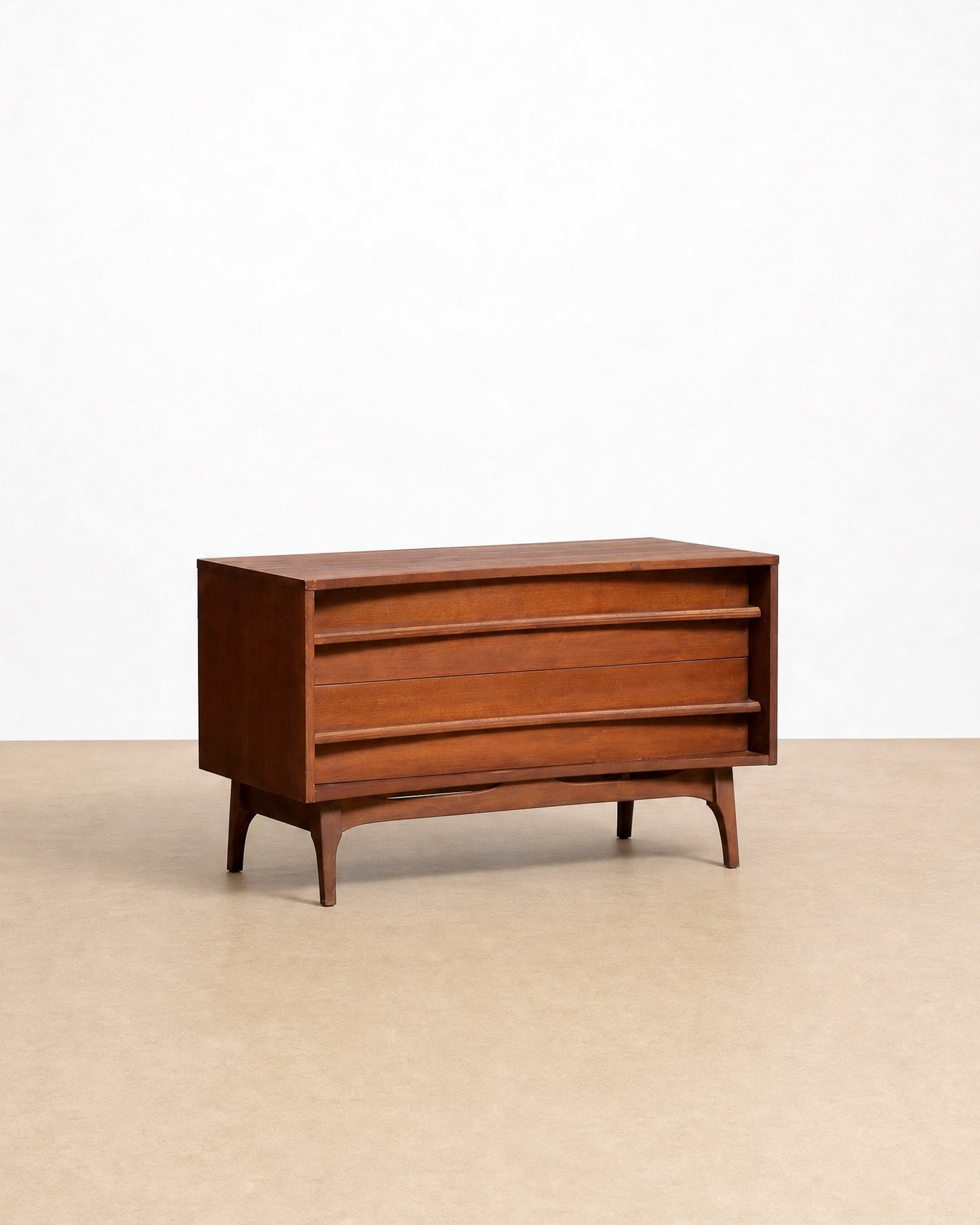 Wooden dresser on a beige floor with a white background