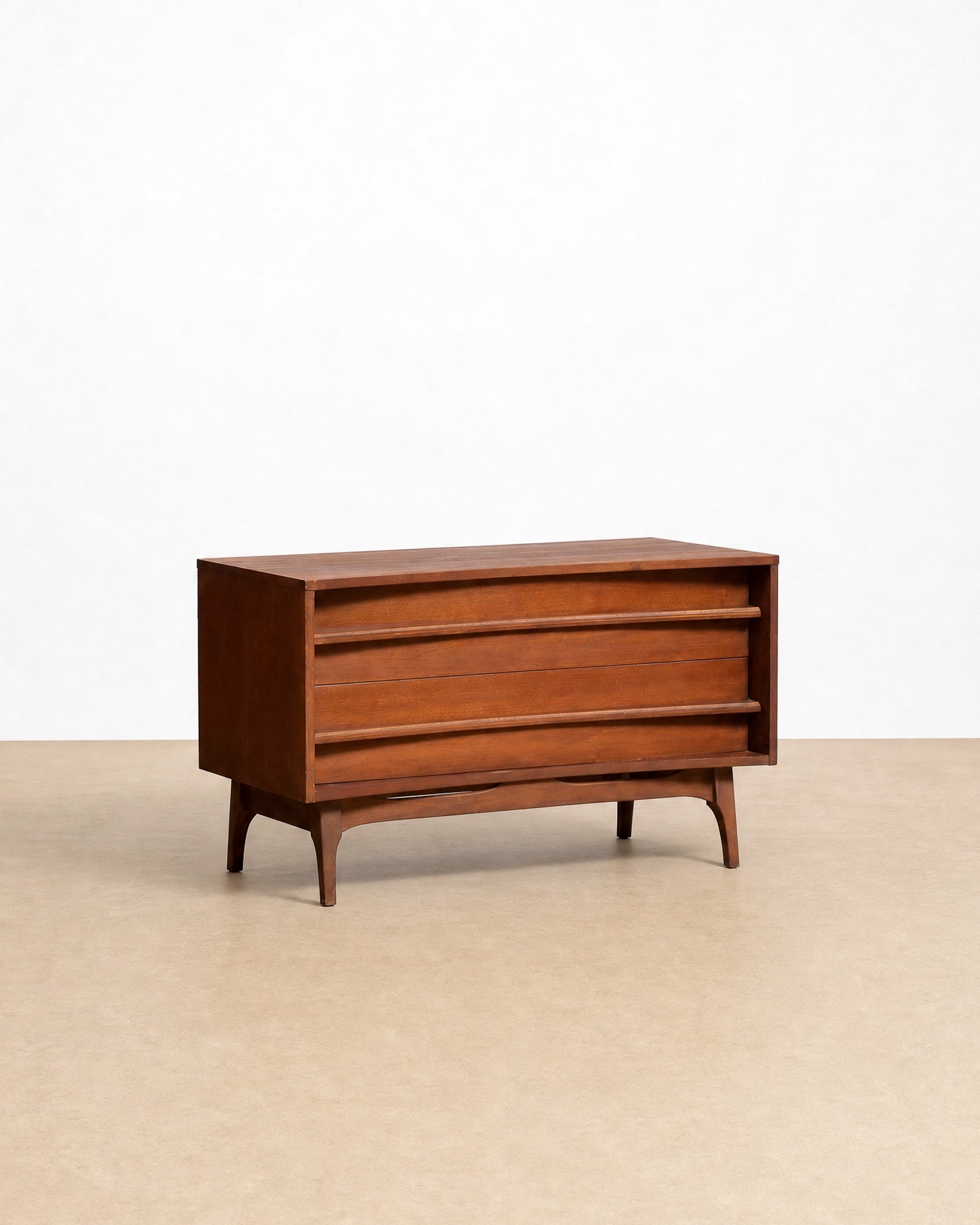 Wooden dresser on a beige floor with a white background