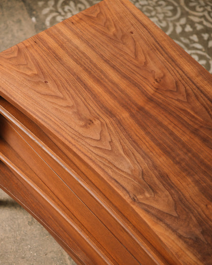 Close-up of a wooden surface with a rich, dark brown finish.