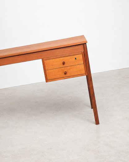 Close-up of the desk's wood grain and joinery detail.