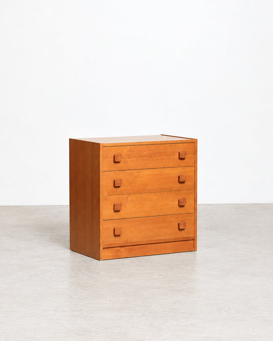 Detail of the dresser's base and bottom drawer with teak pulls.