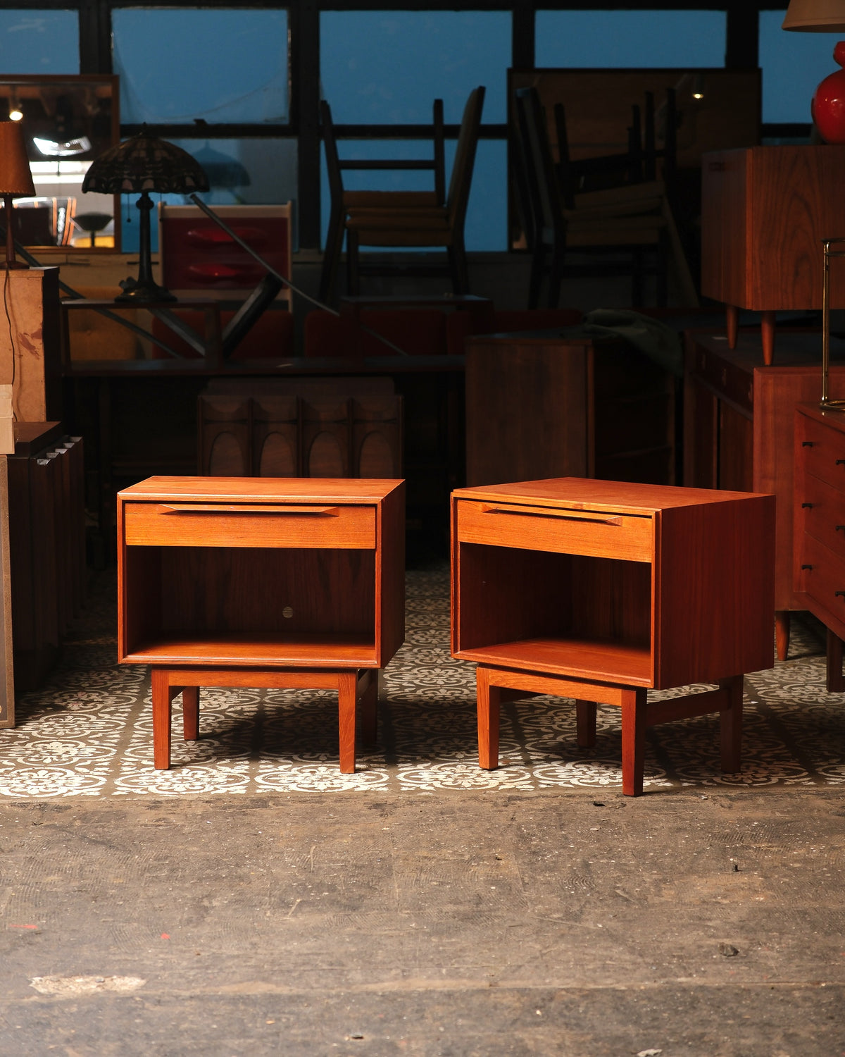 Pair of mid-century modern Danish teak nightstands shown together in the showroom