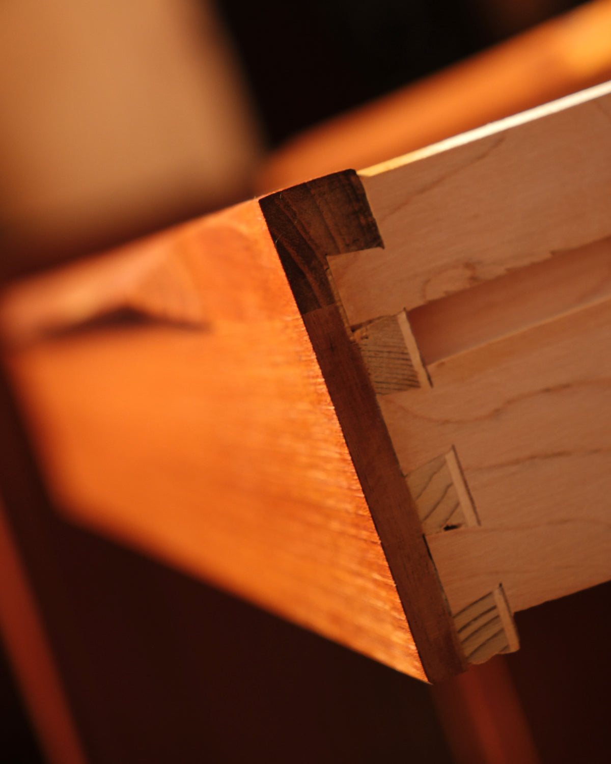 Detail of the wood joinery on the underside of the nightstand drawer