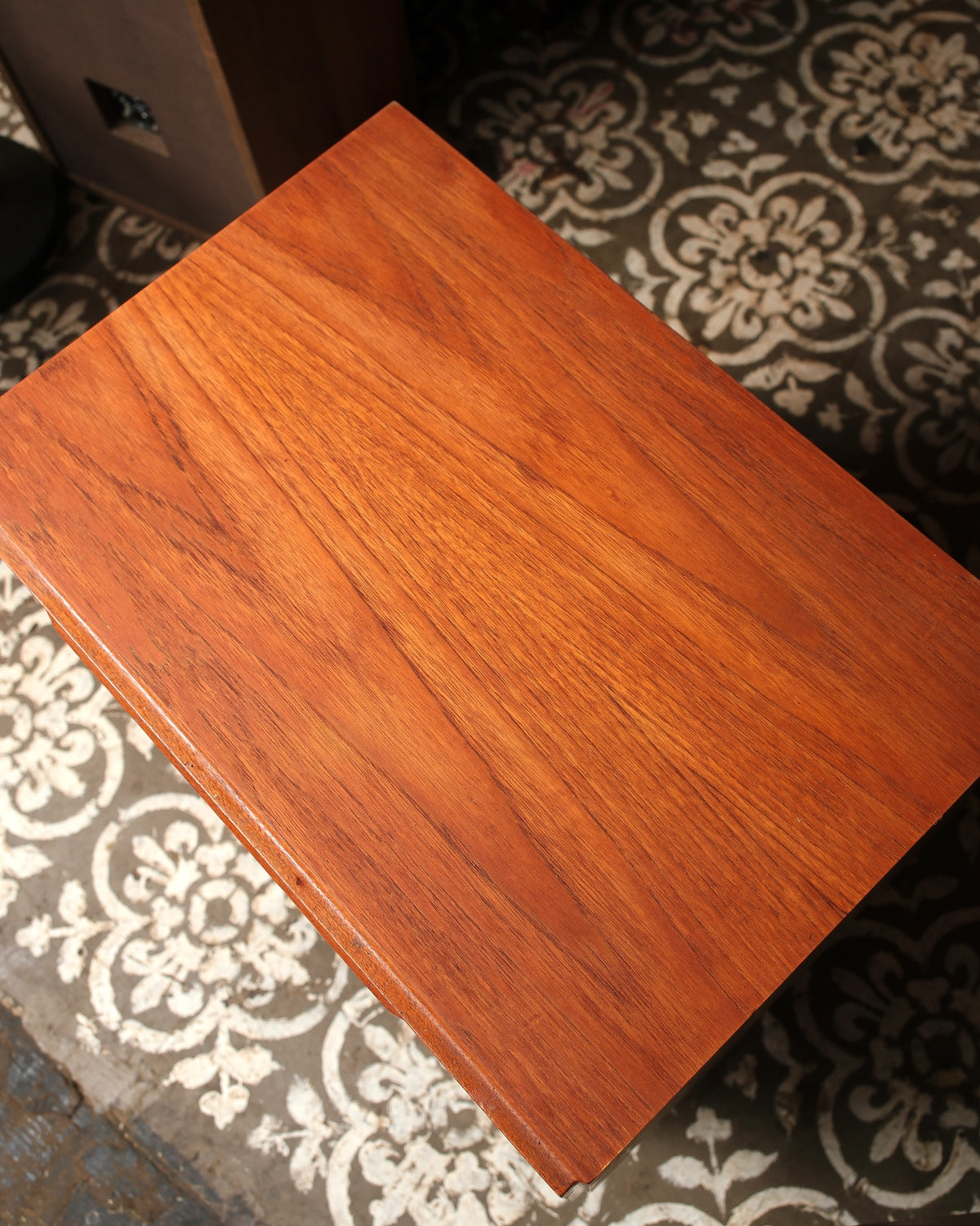 Overhead view of the teak top showing natural grain and finish