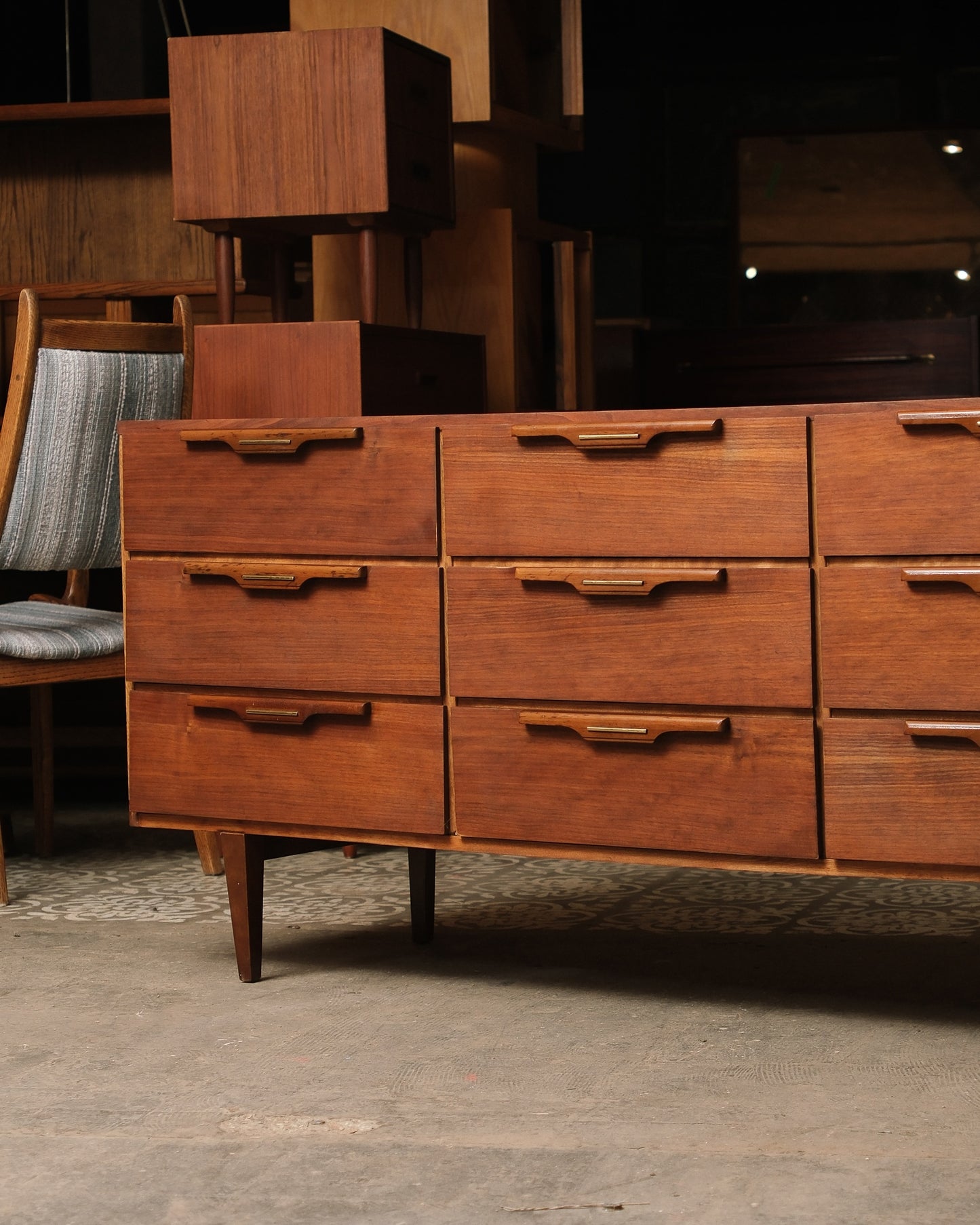 Wooden dresser with multiple drawers in a room setting