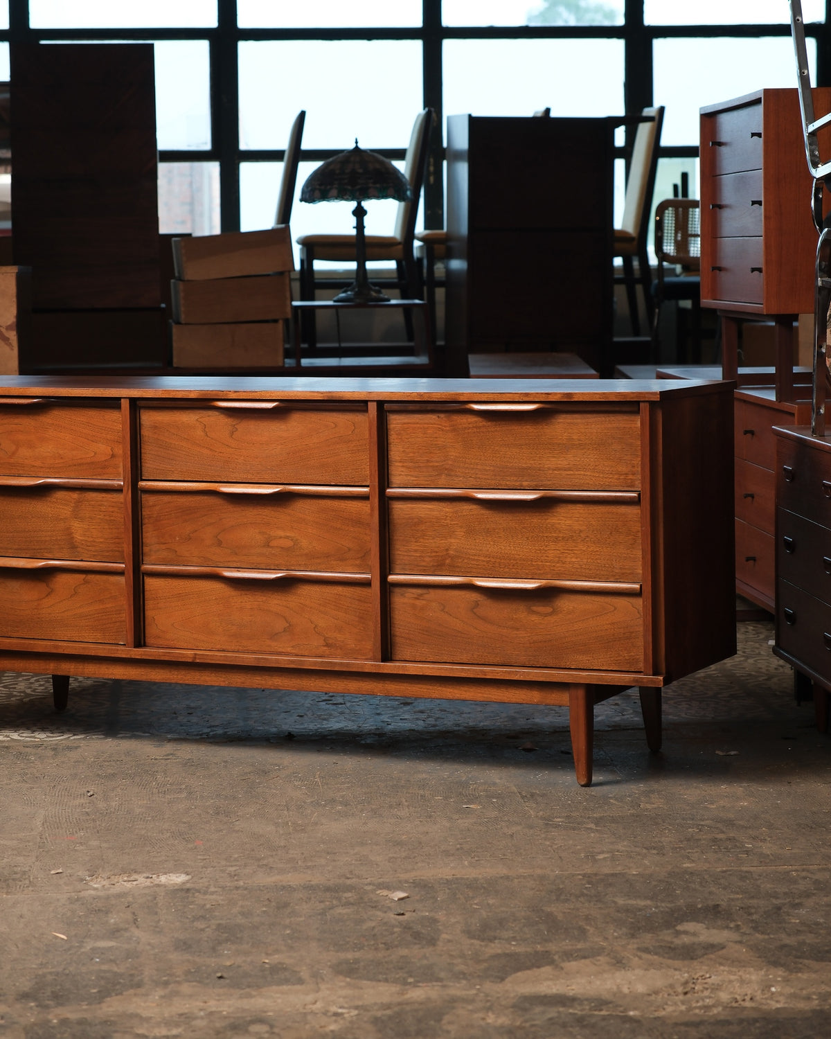 Side angle view showing the full length of the dresser and tapered legs