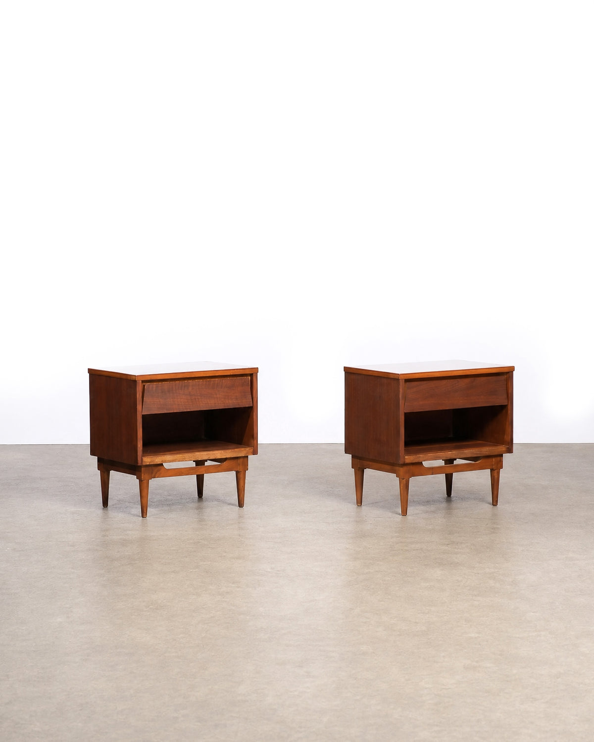 Full view of a single dark walnut nightstand from a slight side angle.