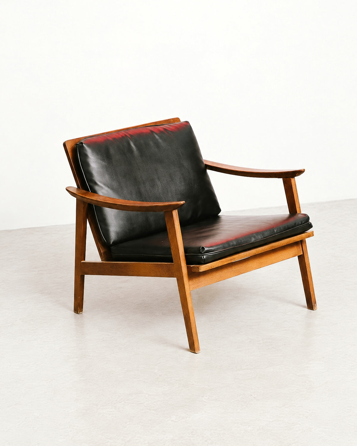 Three-quarter studio view of the lounge chair against a plain white background.
