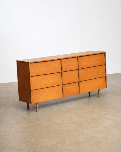 Studio shot of the maple dresser at an angle showing the top surface and drawers.